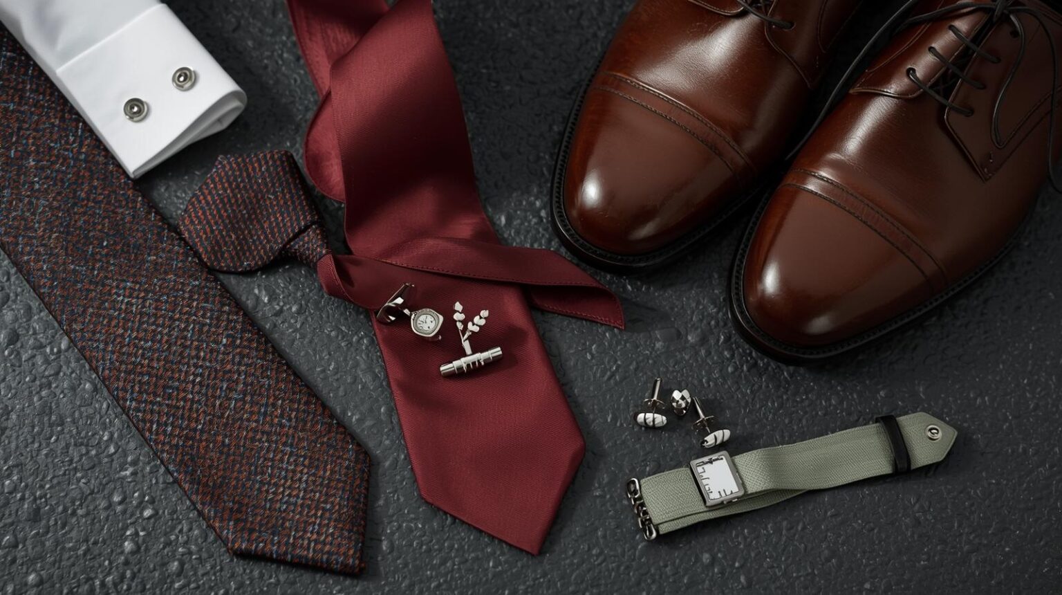 Men’s suit accessories including leather belts, silk ties, and elegant cufflinks, perfect for formal and business wear.