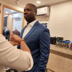 Customer trying on a custom tailored jacket during fitting