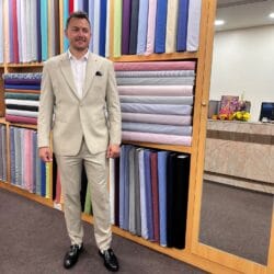 customer wearing beige cavani suit in Sukhumvit Tailor