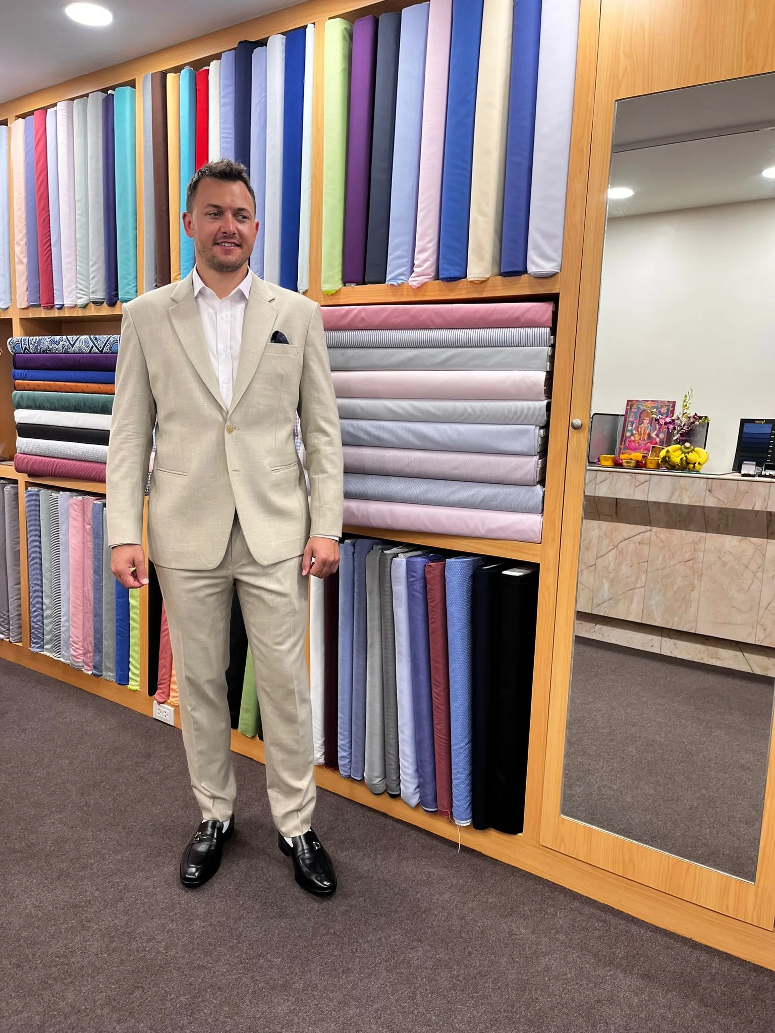customer wearing beige cavani suit in Sukhumvit Tailor