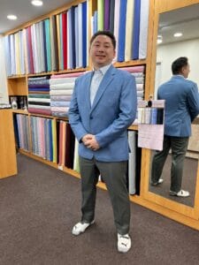 Client wearing a bespoke jacket during final fitting